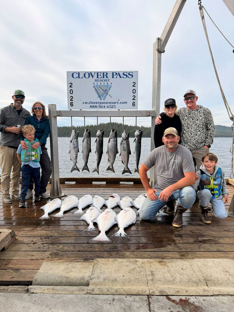 Family with their salmon and halibut at the Clover Pass dock