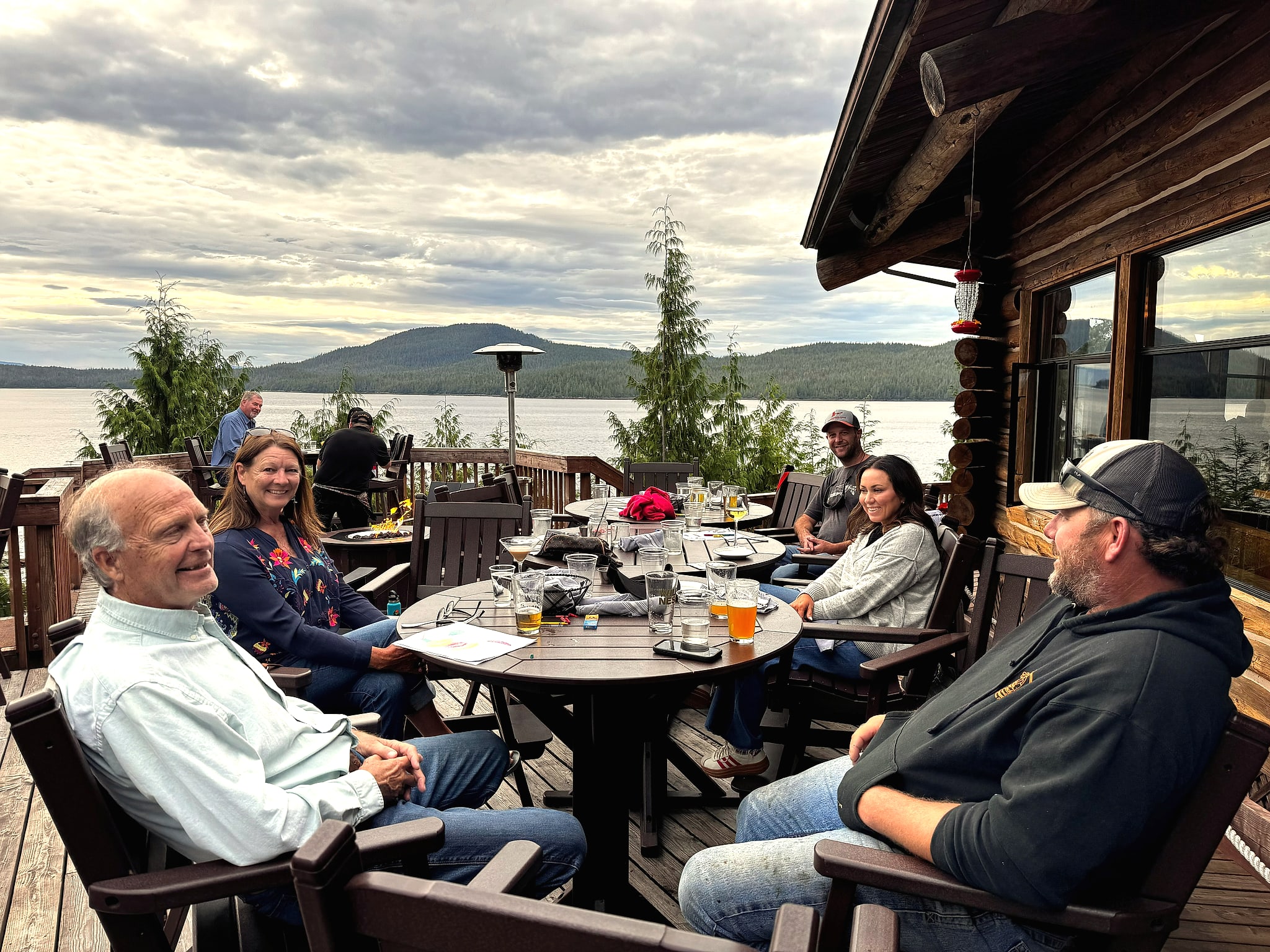 Guests having dinner on a waterfront deck in Ketchikan